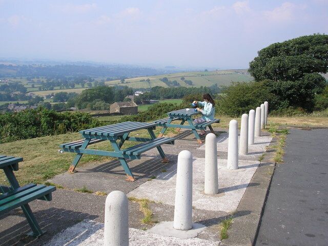 A picnic on Bleara Moor, Yorkshire. The minor road from the A56 at Earby to Lothersdale climbs steeply out of Earby to cross Bleara Moor, and at the crest of the hill the local authority have thoughtfully provided a pleasant picnic site with sturdy tables and car parking. The site has outstanding views over the surrounding countryside and is very popular.