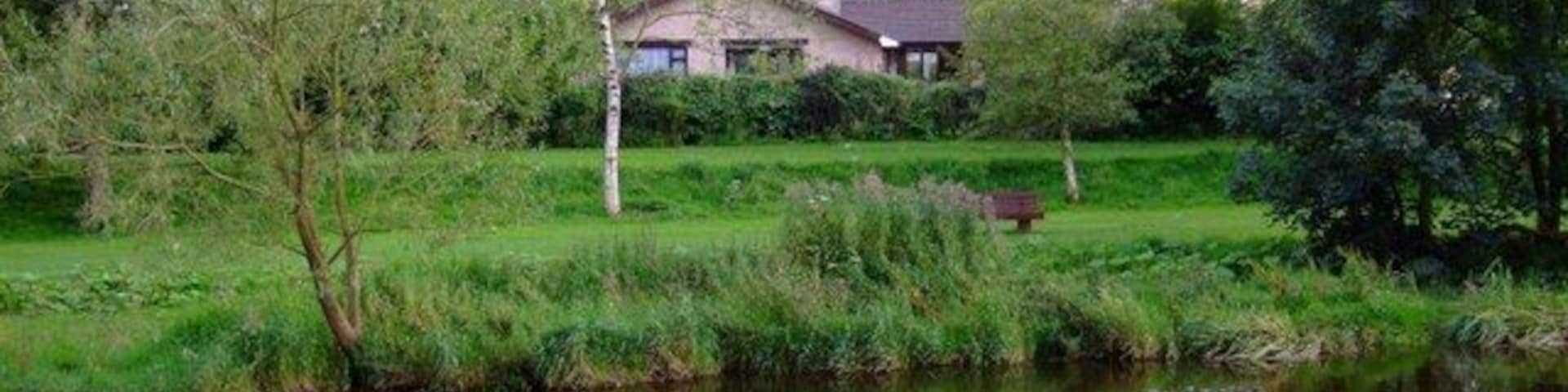 St Andrews from the Aire River Aire between Low and Middle Greens, Gargrave. St Andrews church tower can be seen in the distance.