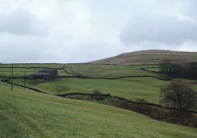 Hud Clough Farm, Facit, Whitworth. The farm is situated beneath the col between Brown Wardle Hill (seen here on the skyline) and Middle Hill (just out of frame on the left).