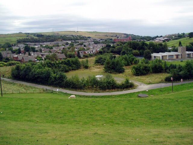View from embankment of Cowm Reservoir The water treatment works is seen at the right.