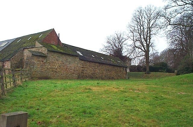 Greasley Castle Farm. Nicholas de Cantelupe's manor house stood close to the Church of St Mary (in the background of this image). He fortified the house and it became known as Greasley Castle. The remains of the fourteenth century building been incorporated into farm buildings still in use today.