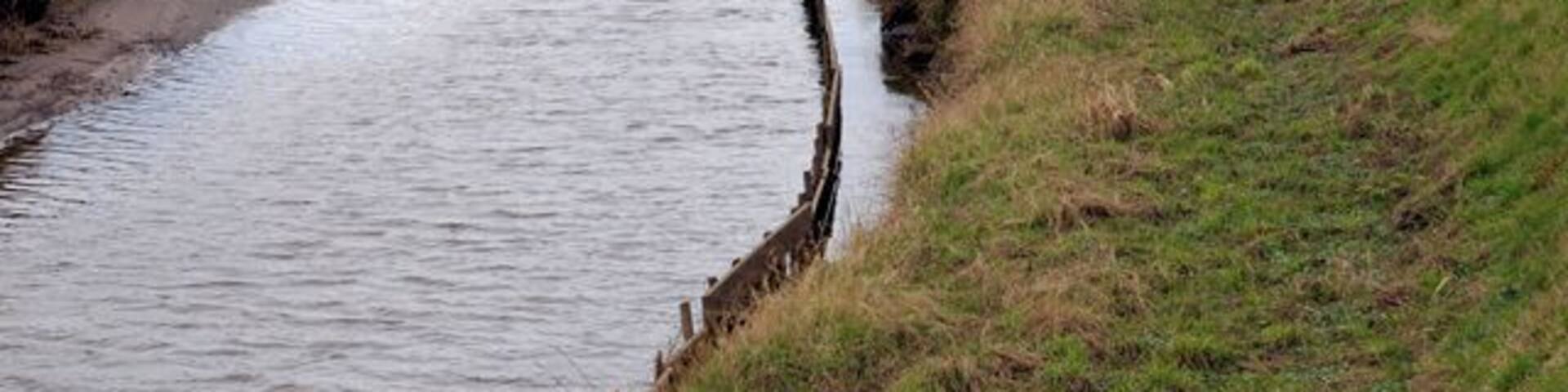 River Alt Note the high banks built to prevent flooding of the surrounding farmland.