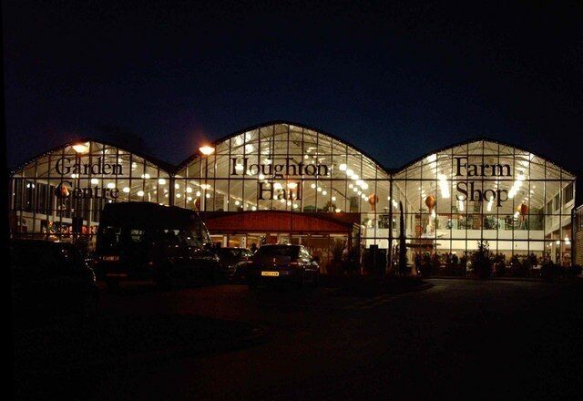 A large glass building with the words "Garden Centre," "Loughton Hall," and "Farm Shop" on its facade.