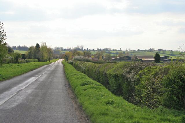 Bridegate Lane between Hickling and Hickling Pastures. Lincoln Lodge behind the hedge on the right and a small wood, Parson's Thorns, to the left.