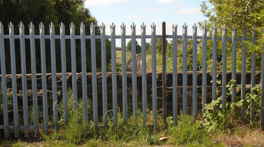 The stone parapet is low, hence the fence.