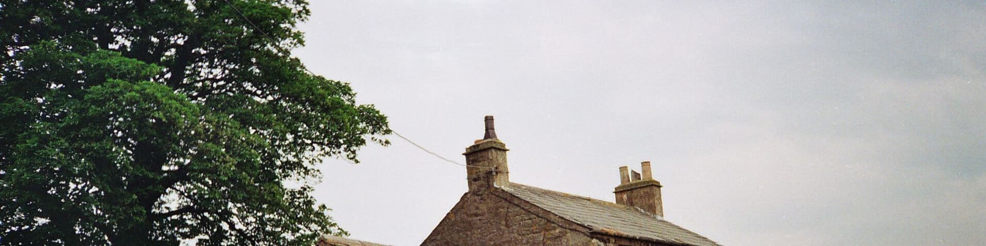 Whelpstone Lodge The old farm house of Whelpstone Lodge. The track in the foreground leads to Owlshaw farm which is the white building in the distance to the left of the tree trunk. The farm track in the picture is officially in Yorkshire but on its short journey to Owlshaw briefly enters back into Lancashire officially. The county boundary being marked by a dry stone wall which the track passes through then after a short distance enters back into Yorkshire through the same wall line. There are no border guards or customs bureaucrats to hassle the free thinking, free roaming poets of the free wild fells. The border line here is part of the 'new'1974 boundary between the Red Rose county of Lancashire and the White Rose of Yorkshire, these being the dictates of control bureaucracies. The old boundary bit deep into the 'Red Rose' making Lancashire geographically resemble a wasps body! The extremity of the 'White Rose' bite was on the high fells of Bowland over looking the Irish sea which was just 9 miles west along SD51 grid line to the coast at Morecambe Bay. This old county boundary area was near 'Greave Clough Head' and 'White Moss' at 1520ft(464M) both being in SD5750. The western extremity of this former boundary is marked on the map as a mound at SD574509 just south of 'Johnny Pye's Clough Top'. Johnny Pye's Clough Top is in SD5751 which also lies on the old county boundary line marked by another mound a short distance towards the north east. A little further on still (NE) the trig point of 'Hawthornthwaite Fell Top' 1567ft (476M) SD579515 was on the former Lancashire/Yorkshire border. Many of us free spirits do not recognise these 'new' 1974 border lines and still refer to villages and places as being in the Red Rose or White rose counties of former times pre 74, even if it does make old Lancashire take the form of a wasps body. Also don't forget we Lancastrians had the south peninsulas of the Lake District dipping into the north of Morecambe Bay. But Yorkshire men and women are wary of us Lancashire folk because they know we have a damned good sting !