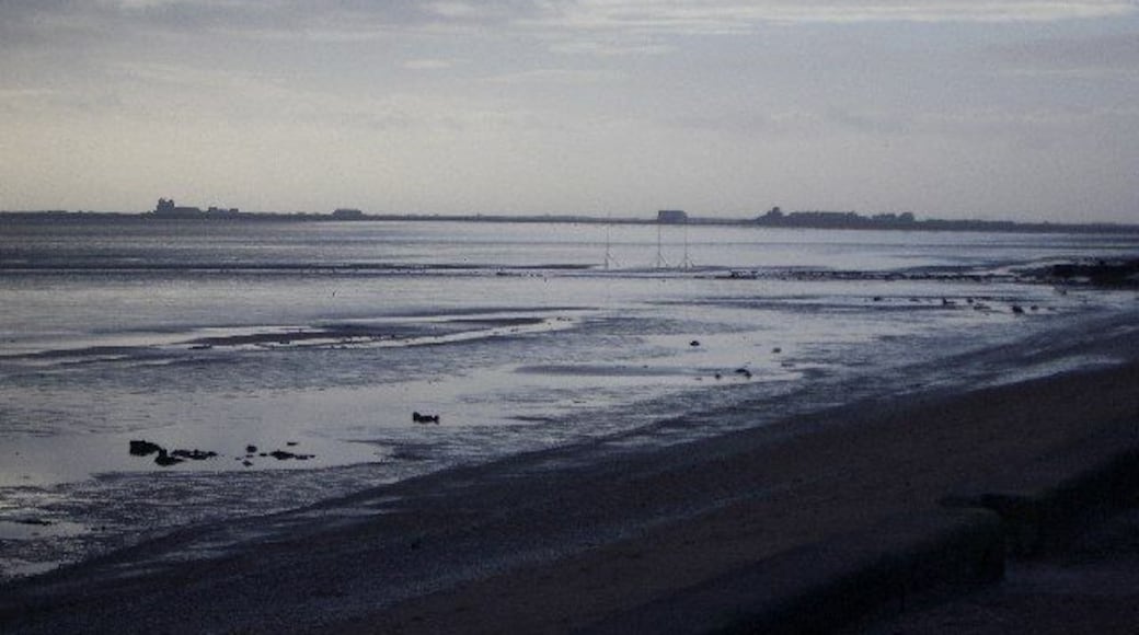 From Rampside towards Piel. This picture was taken from the coast road looking towards Piel Island. Roa Island and the lifeoat station can be seen on the horizon.