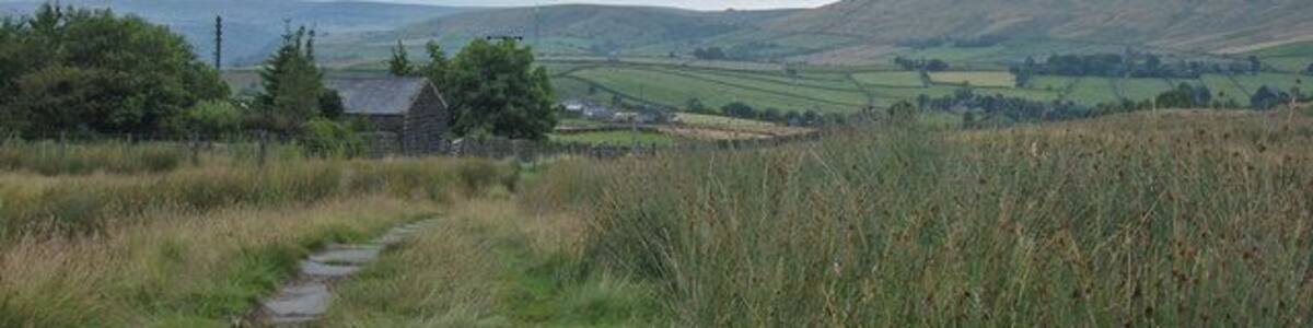 Pennine Bridleway, above Lumbutts Looking northeast along the bridleway. In about one hundred metres the bridleway joins Lumbutts Road, one of the few road sections on the Mary Towneley Loop part of the National Trail. Stoodley Pike can be seen on the skyline.