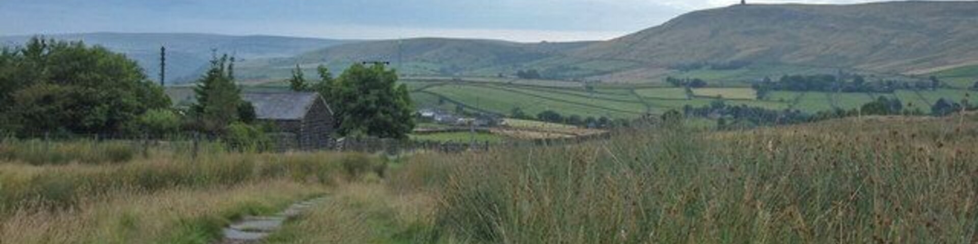 Pennine Bridleway, above Lumbutts Looking northeast along the bridleway. In about one hundred metres the bridleway joins Lumbutts Road, one of the few road sections on the Mary Towneley Loop part of the National Trail. Stoodley Pike can be seen on the skyline.