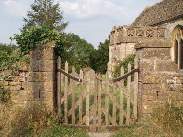 Wooden gate to St James' parish churchyard, Churchend, Charfield, Gloucestershire