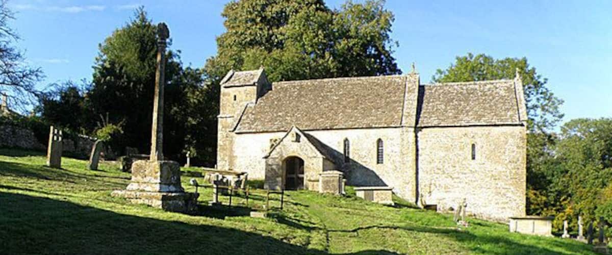St Michael's Church, Duntisbourne Rouse This church comes complete with a saxon nave and a 14th century cross with its original mutilated head. I'm assuming the cross can be seen on the left.