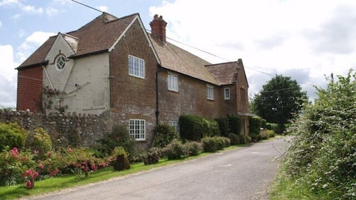 Hainshill House A fine stone house by the junction at Crock Street. The lane climbs the Blackdown Hills towards Sticklepath.