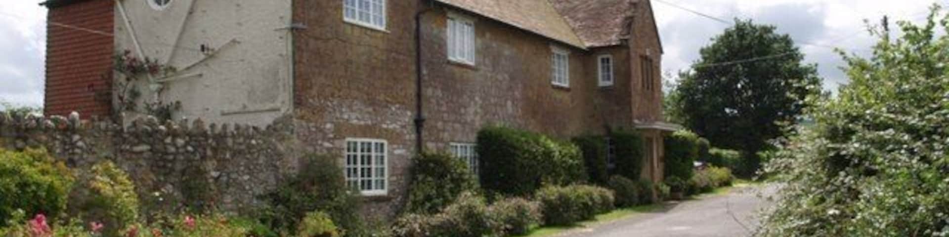Hainshill House A fine stone house by the junction at Crock Street. The lane climbs the Blackdown Hills towards Sticklepath.