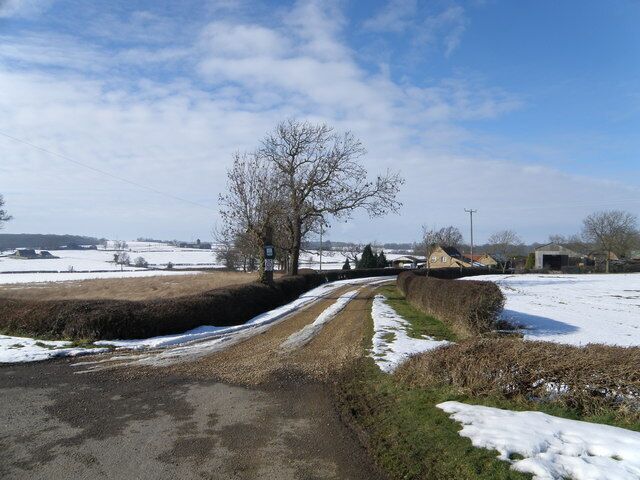 Oakland's, Caldecote A farm with a caravan and camping field adjacent to the farmyard.