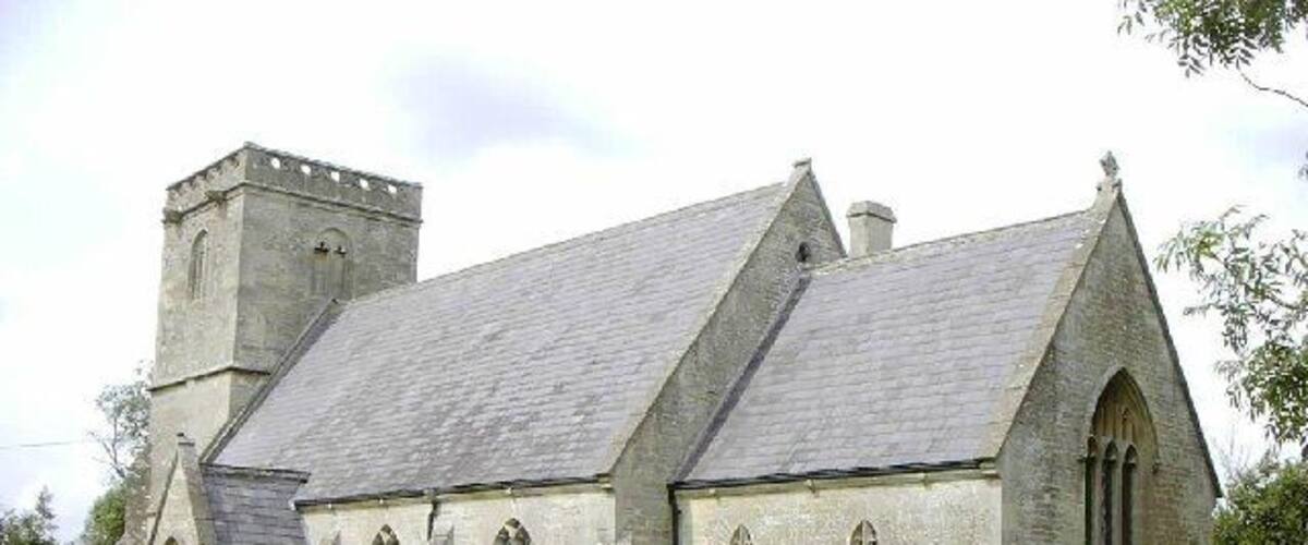 A church with a tower and a graveyard.