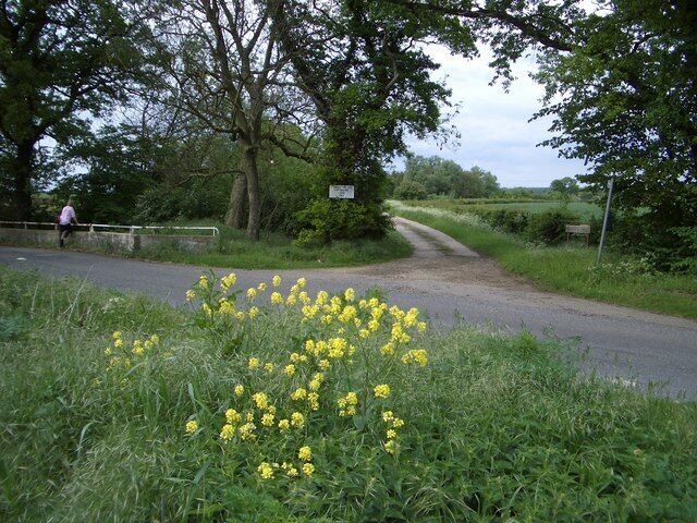 Mile Brook Bridge & Bridleway West of Upton Mile Brook Bridge, probably named after the distance from Hamerton to the west, crosses the Alconbury Brook to the left of this view. The farm track ahead is also a public bridleway to Coppingford Lodge and the Bullock Road beyond, the latter a former cattle drover's trackway.