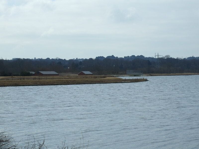 Longham Lake The southerly of the two reservoirs, that provides an average of 7 days water storage for the Bournemouth area. This reservoir has only just recently been filled, previously it was a sand and gravel pit. The surrounding area is still being landscaped. The buildings are part of the pumping facilities.