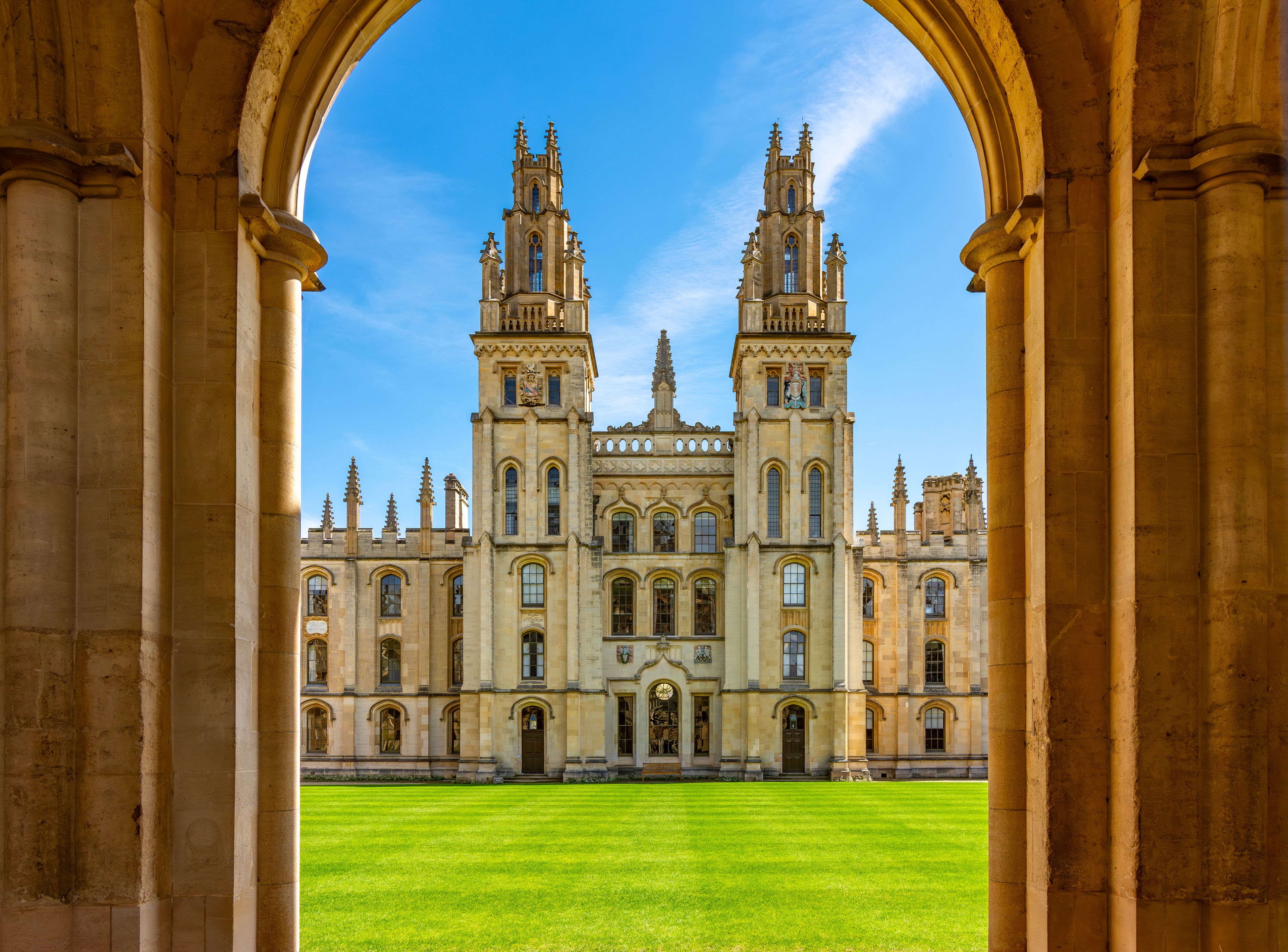 A historic building with twin towers and a large central entrance.