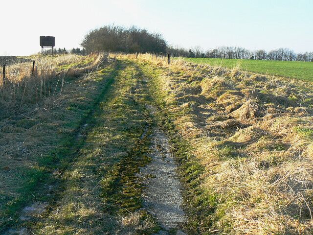 West along the White Horse Trail, near Highway This view is towards the top of Highway Hill where the trail follows the bridleway towards the hamlet of Highway. The old water tank on the left is just west of this square.