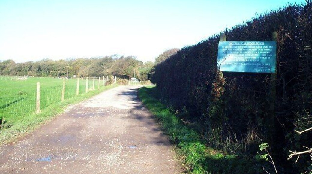 Lane to Lilstock beach. Access to the beach car park is via a private road. The sign details what conditions there are for its use by the general public. The photograph is taking looking north at the junction with the lane to Lilstock.