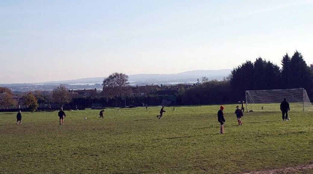 Lytchett Matravers Recreation Ground, Dorset. Sunday morning soccer practice. Poole Harbour is in the distance.