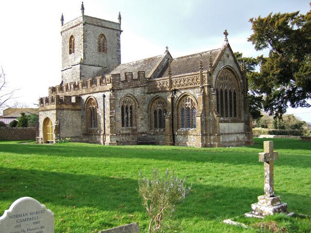 A historic church with a tower and arched windows.