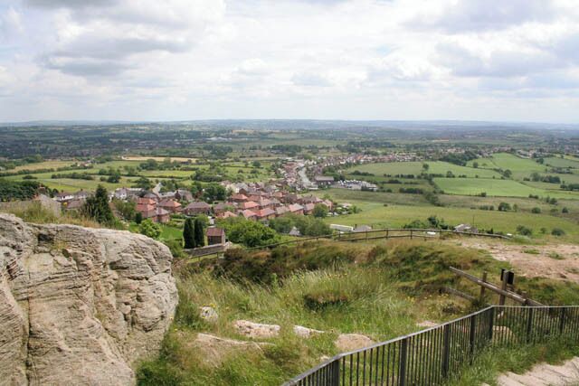 View from Mow Cop Castle This eighteenth century folly affords fine views across the countryside. This shows the view to the south east across the modern housing in Mow Cop and the ribbon development of Harriseahead SJ8656 along Sands Road. Biddulph SJ8756 is in the distance to the left.