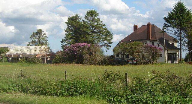 Houses - one being re-built - near Holman Clavel These buildings are close to the cross roads with the B3170.