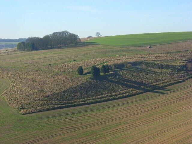 The Slay Arable fields surround the steep ground of the dry valley.