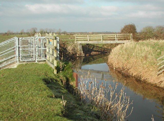 Pilhay Bridge and sluice on Congresbury Yeo river. Pilhay bridge joins the villages of Yatton and Puxton and lies at the end of 'Gang Wall' an ancient walkway over the wetland. The sluices are used to control flooding of the surrounding wetlands which lie below river level. NB: PS reading showed bridge to be 8 feet above MSL.