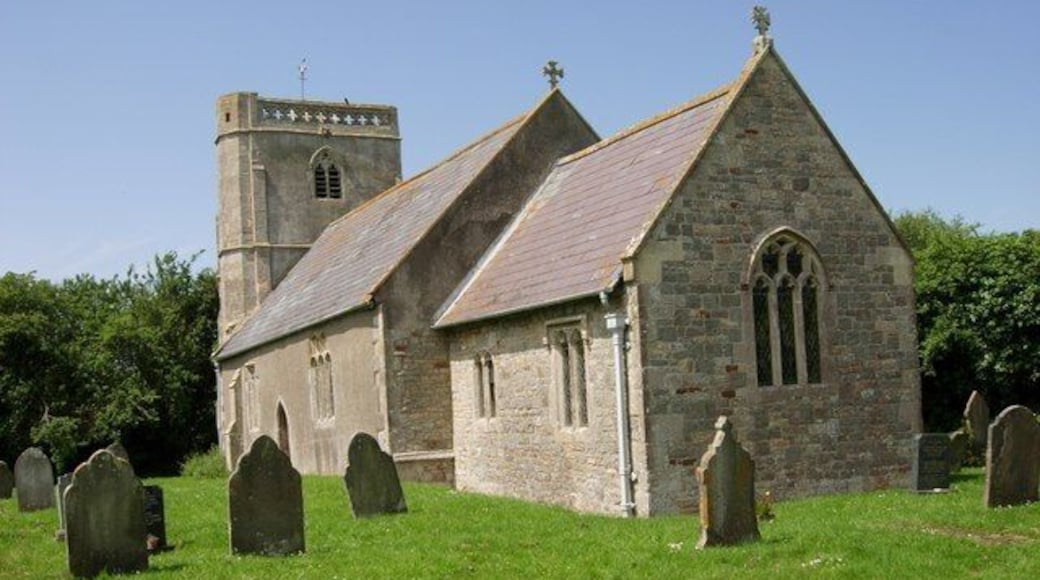 Puxton, Holy Saviour. Parish Church, Grade I. Largely 15th & 16th Century. North porch dated 1557. Tower leans considerably to west. Inside worth a visit with Reading desk and panelled octagonal pulpit flanking chancel arch, wrought iron hourglass stand by pulpit. Early/mid 16th Century heavy oak pews in most of nave. 5 18th Century box pews. Norman tub font, scraped, 17th Century strapwork cover. 17th Century door with bar at south. Royal arms, 1751 over south door.