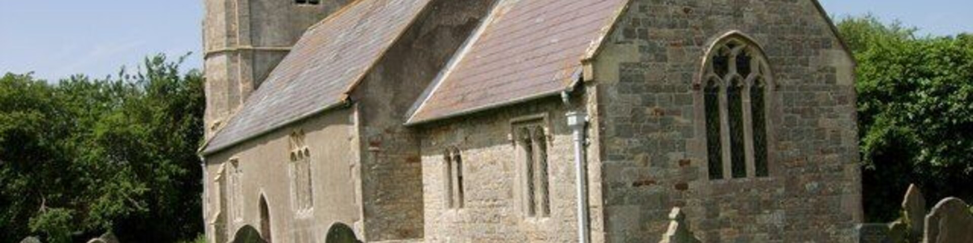 Puxton, Holy Saviour. Parish Church, Grade I. Largely 15th & 16th Century. North porch dated 1557. Tower leans considerably to west. Inside worth a visit with Reading desk and panelled octagonal pulpit flanking chancel arch, wrought iron hourglass stand by pulpit. Early/mid 16th Century heavy oak pews in most of nave. 5 18th Century box pews. Norman tub font, scraped, 17th Century strapwork cover. 17th Century door with bar at south. Royal arms, 1751 over south door.