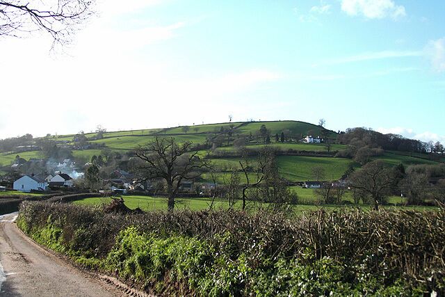 Southleigh: nearing the village Looking west with Glebe House on the hill on the right