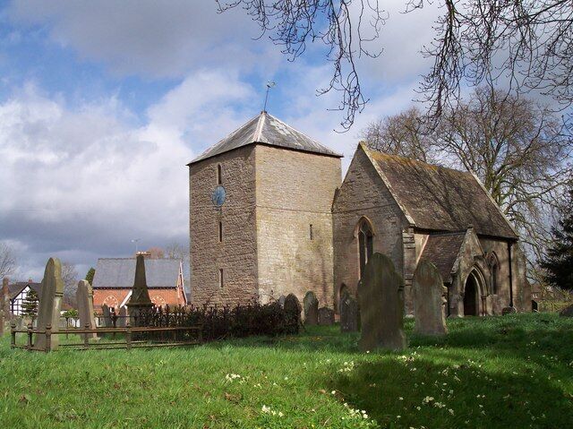 A church with a tower and a graveyard.