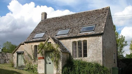 St Michael's Cottage, Winson. This small cottage is situated in the corner of the churchyard.