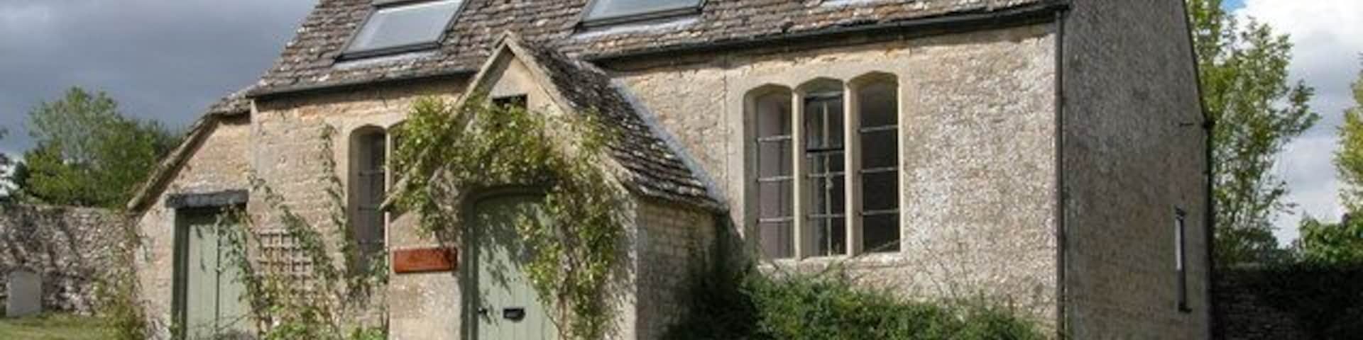 St Michael's Cottage, Winson. This small cottage is situated in the corner of the churchyard.