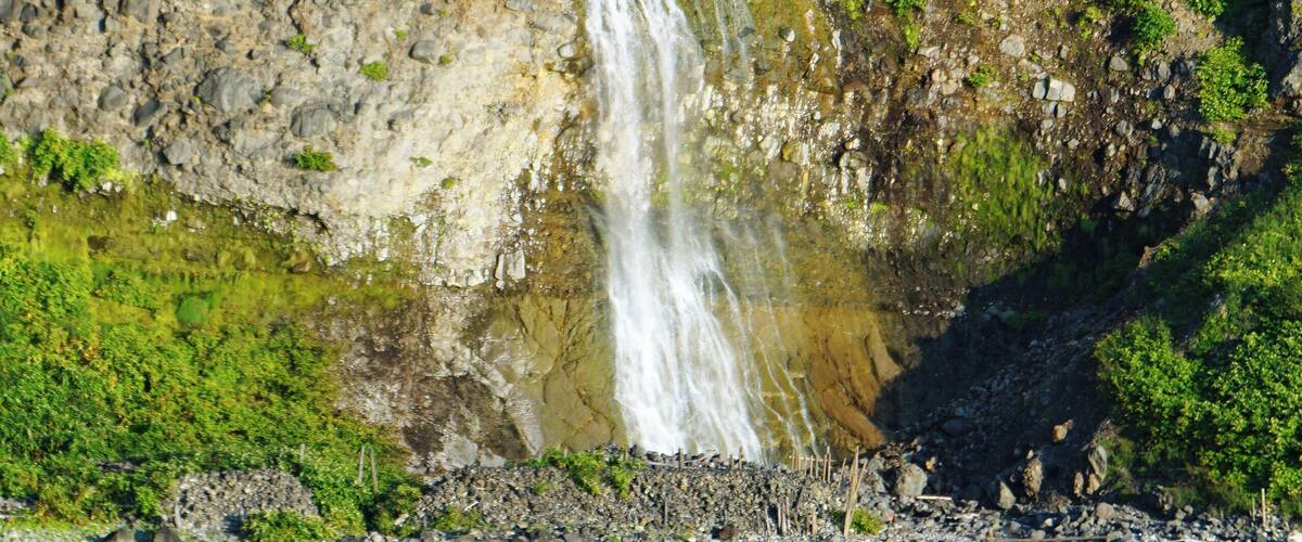 Kamuiwakka Falls and Mount Iō (Shiretoko) in Shari, Hokkaido prefecture, Japan.