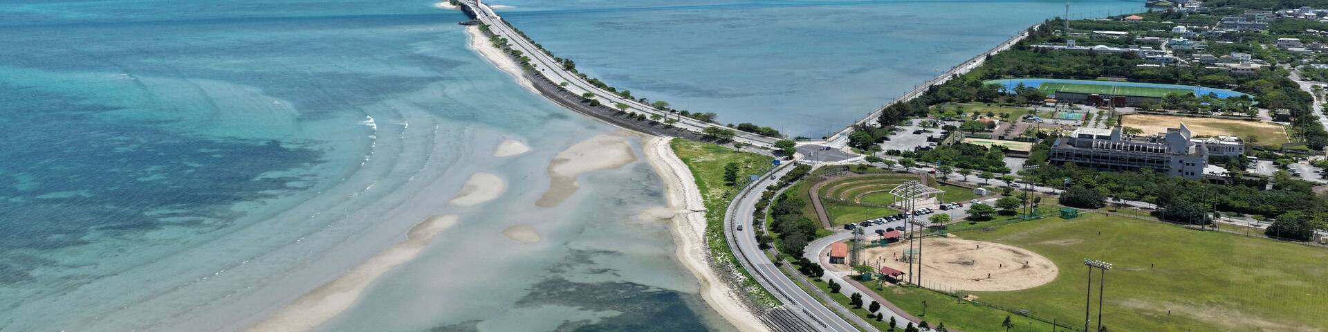 Aerial view of Kaichu Road bridge over turquoise ocean in Okinawa Japan in April