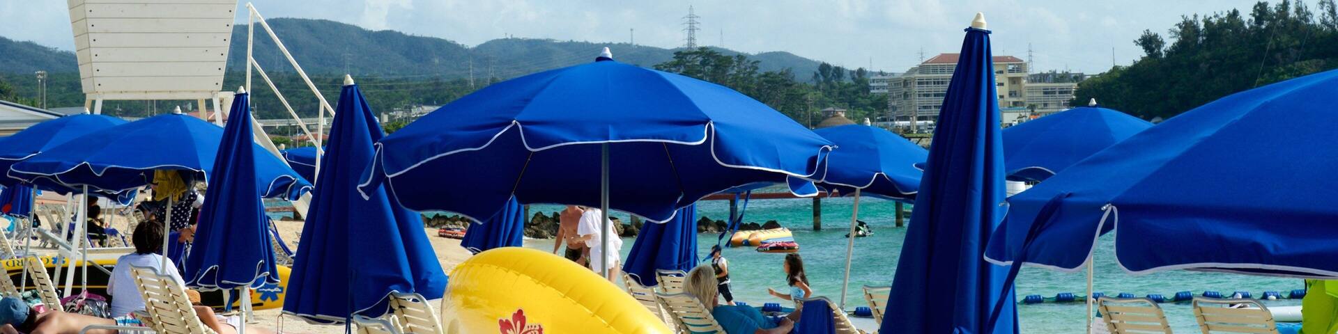 Okinawa which includes general coastal views and a coastal town