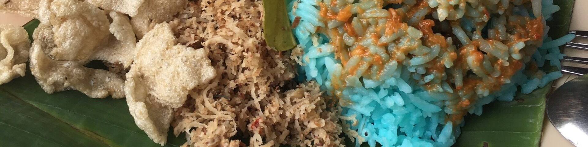 Nasi Kerabu is using a type of flower to make the colour. The rest of the side dish are mainly raw. Delicious and cheap in this small store near the waterfall area of FRIM, the reserve rainforest. #GoodEats