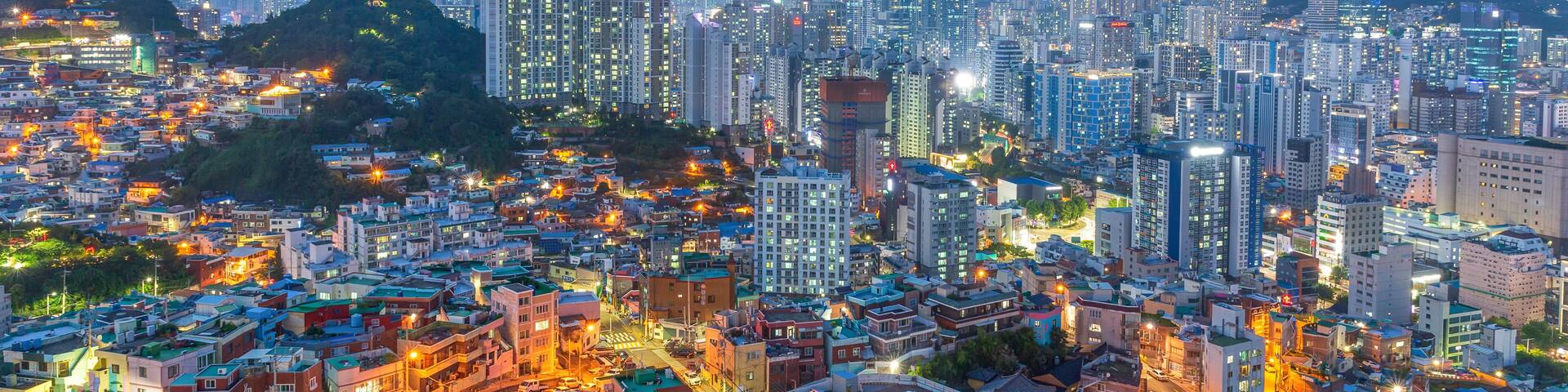 The night view of the city with buildings and villages seen from the Dong-gu Library Observatory in Busan, Korea.