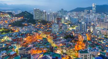 The night view of the city with buildings and villages seen from the Dong-gu Library Observatory in Busan, Korea.