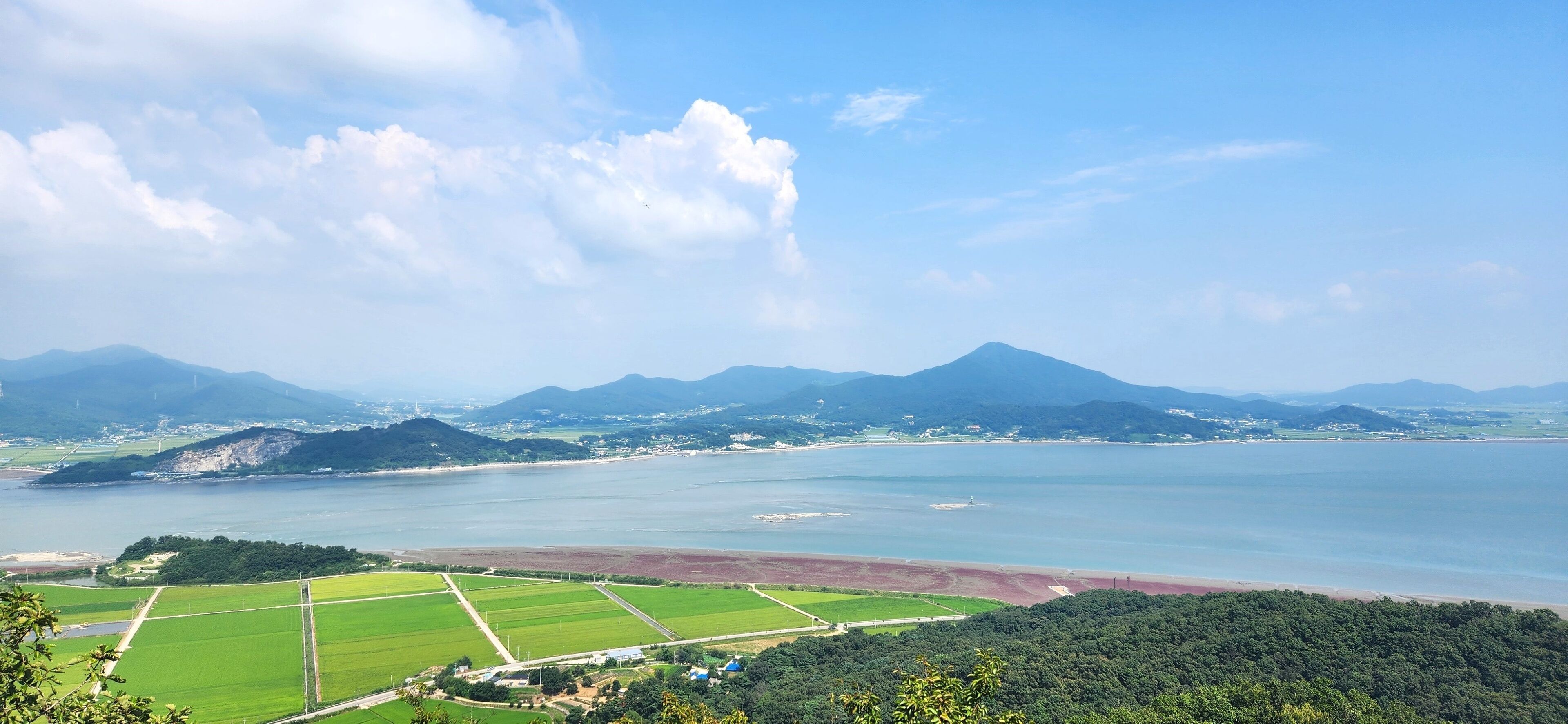 the top of Haemyungsan Mountain in Korea in sunny weather. hiking in korea. mountains Korea Seoul. View from the top of the mountain to the sea. island in Korea. Seokmodo Island Korea