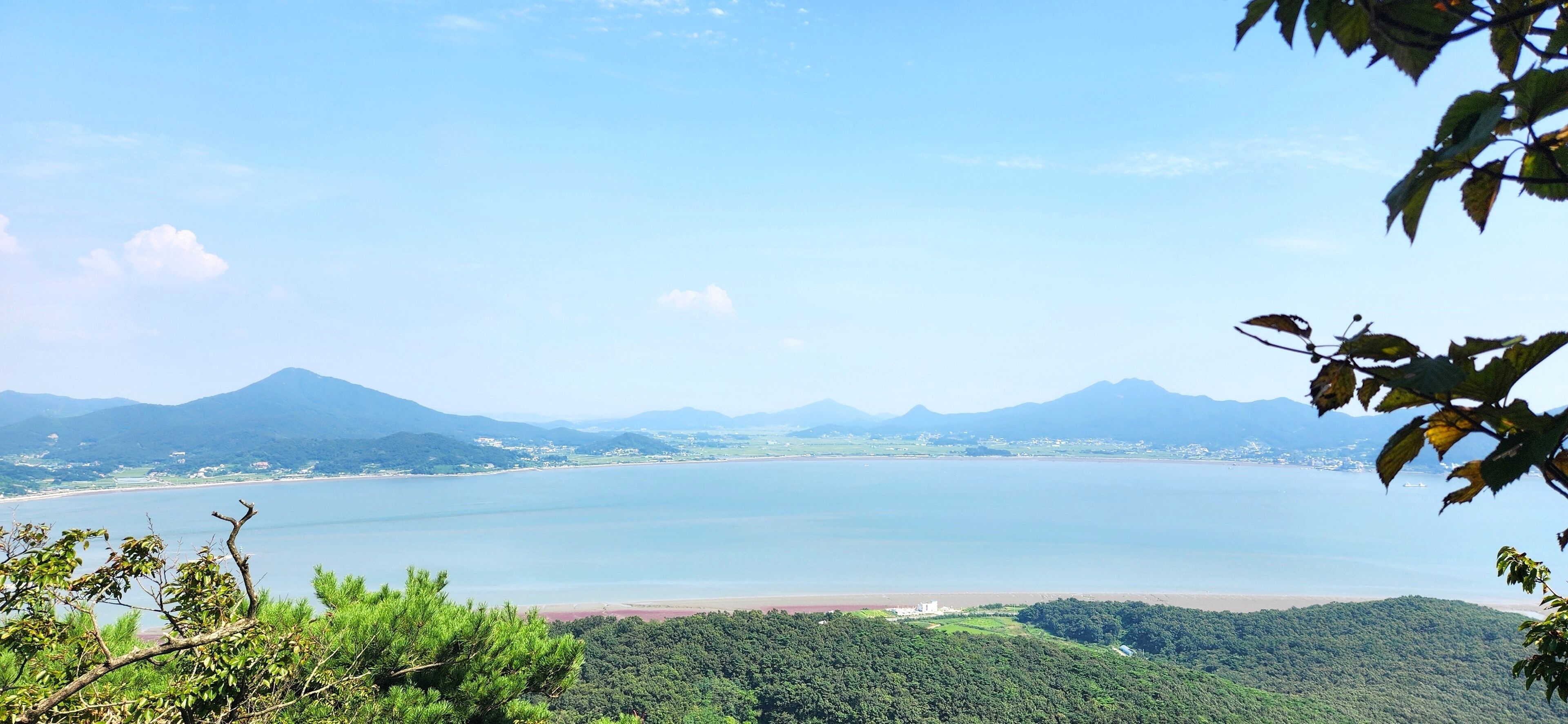the top of Haemyungsan Mountain in Korea in sunny weather. hiking in korea. mountains Korea Seoul. View from the top of the mountain to the sea. island in Korea. Seokmodo Island Korea
