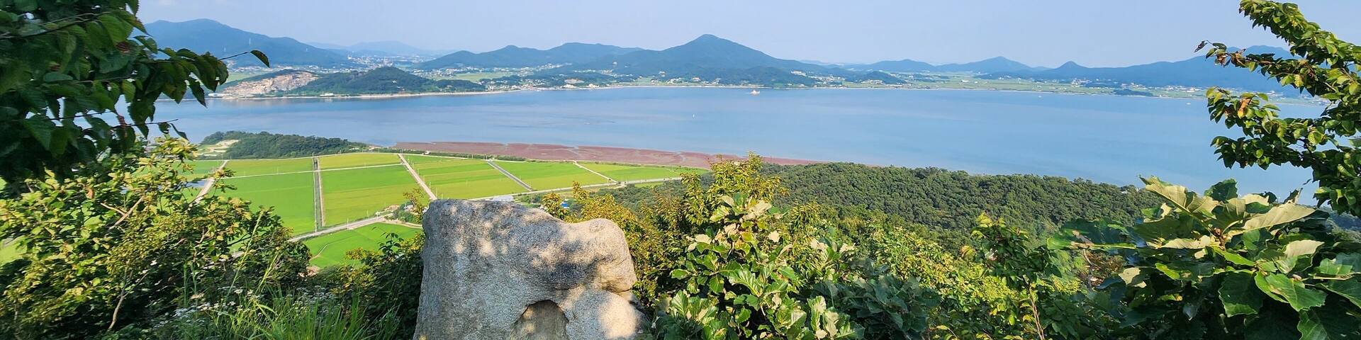 the top of Haemyungsan Mountain in Korea in sunny weather. hiking in korea. mountains Korea Seoul. View from the top of the mountain to the sea. island in Korea. Seokmodo Island Korea