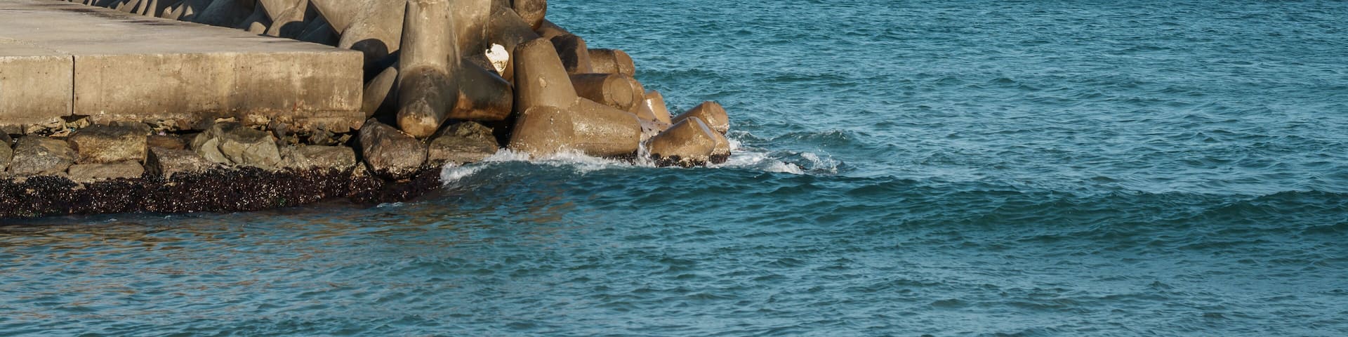 Red Lighthouse and Tetrapods at Naksan Beach Breakwater, South Korea