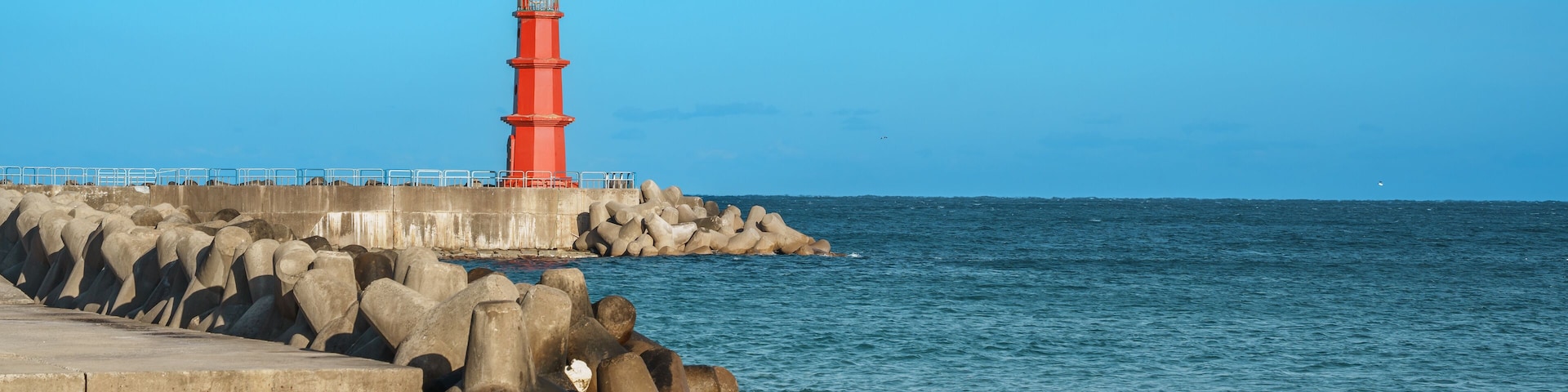 Red Lighthouse and Tetrapods at Naksan Beach Breakwater, South Korea