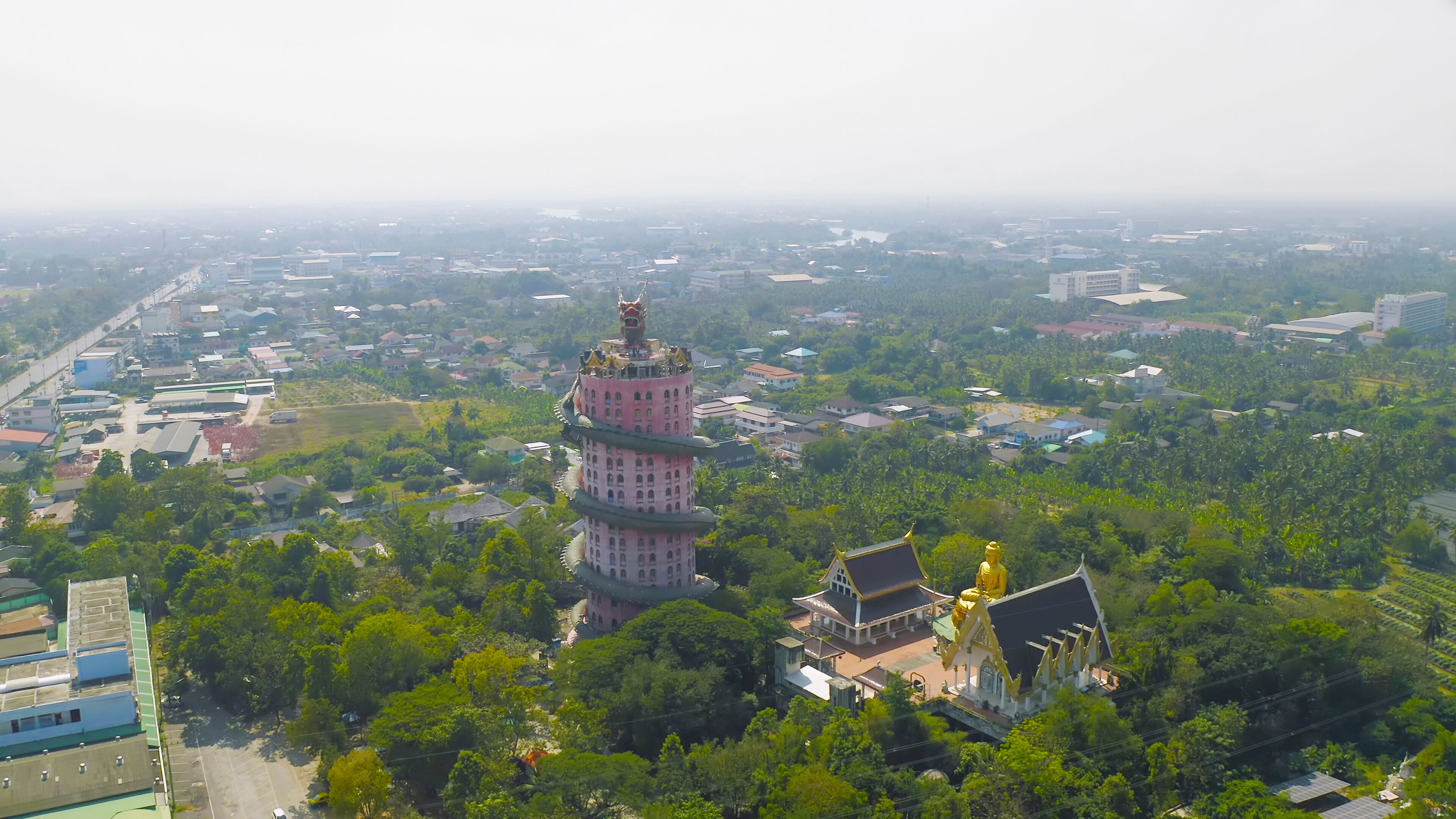 Aerial view of Wat Samphran or Chinese Dragon Temple in Sam Phran District in Nakhon Pathom province near Bangkok Urban City, Thailand. Tourist attraction landmark in travel trip concept.