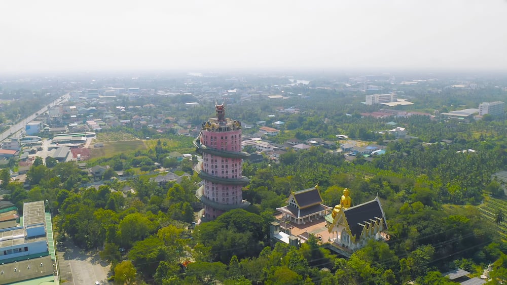 Aerial view of Wat Samphran or Chinese Dragon Temple in Sam Phran District in Nakhon Pathom province near Bangkok Urban City, Thailand. Tourist attraction landmark in travel trip concept.