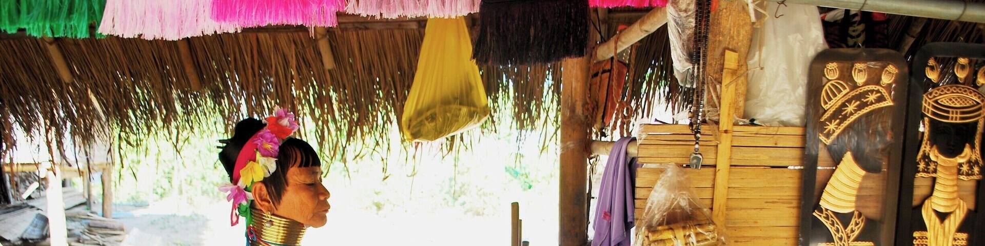 A woman from the Karen Long Neck Tribe.
In our day tour to Chiang Rai (the White Temple), we managed to squeezed in a quick trip to a village where a Karen tribe resides. The Karen tribe are infamous for their long necks, resulting from a lifetime of wearing brass coil neck rings (that increase in quantity as they age). Not all women from this tribe wear the neck rings however, just a small subset of the tribe called the "Padaung" and there are different accounts as to why they wear these rings. Whatever the origin of the custom, one of the reasons why this tradition continues today is due to tourism. People from all over the world, intrigued by their custom, travel to one of the furthest cities in the north of Thailand just to see them (me included). I wished that I could stay longer and talk to the villagers but due to the tight schedule of the tour, we only managed to take photos of the villagers and buy some souvenirs.
#karenvillage #karen #thailand #southeastasia #asia #travel #wanderlust #culture #people